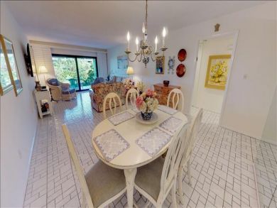 Just Steps to the Sandy Beach from this Two Bedroom Condo